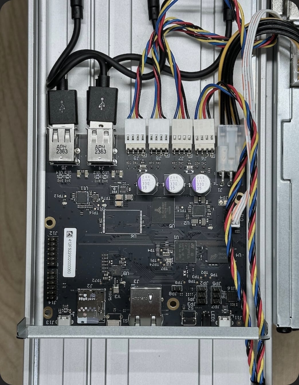 Top view of control board with front fan calbes running through control board faceplate